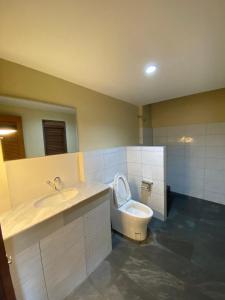 a bathroom with a toilet and a sink and a tub at keio place in Thong Nai Pan Yai +32 photos