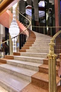 a set of stairs in a building with a chandelier at Meliá Caracas in Caracas