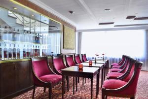 a row of tables and chairs in a restaurant at Meliá Caracas in Caracas +30 photos
