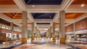 a lobby of a hotel with tables and chairs at Meliá Puerto Vallarta in Puerto Vallarta +75 photos