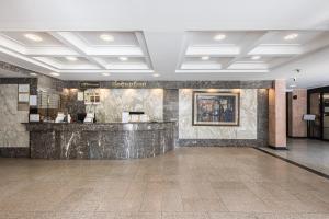 a lobby with a marble counter in a building at Insadong Crown Hotel in Seoul