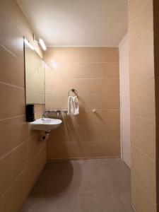 a bathroom with a sink and a mirror at The Saanj Villa in Sānand +9 photos
