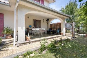 an outdoor patio with a table and chairs at La Pennica bnb in Pontremoli