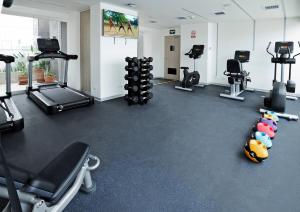 a gym with treadmills and exercise equipment in a room at INNSiDE by Meliá Lima Miraflores in Lima +55 photos