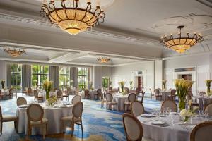 a banquet room with tables and chairs and chandeliers at The Ritz-Carlton Key Biscayne, Miami in Miami