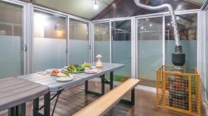 a table with a plate of food on it in a room at Daebudo Freesia Private Pool Villa in Ansan