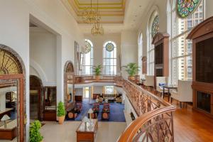 a large lobby with a staircase and windows at ITC Grand Central, a Luxury Collection Hotel, Mumbai in Mumbai