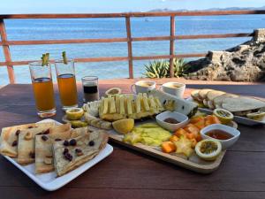 a table with a tray of food and drinks on it at Nosy Komba Lodge in Nosy Komba +48 photos