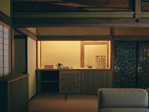 a bathroom with a mirror and a sink in a room at KAZENO Kurayoshi in Kurayoshi +100 photos