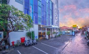 a rendering of a city street with a building at Kuta Beach Hotel in Kuta