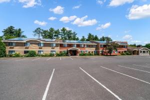 a large parking lot in front of a building at AmericInn by Wyndham Cloquet in Cloquet