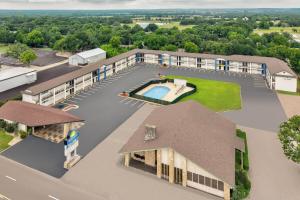 an aerial view of a building with a swimming pool at Days Inn by Wyndham Gatesville in Gatesville