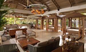 a lobby of a resort with chairs and tables at Meliá Caribe Beach Resort - All Inclusive in Punta Cana