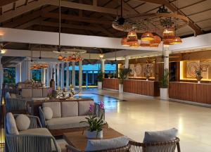 a lobby of a resort with couches and tables at Meliá Caribe Beach Resort - All Inclusive in Punta Cana +62 photos