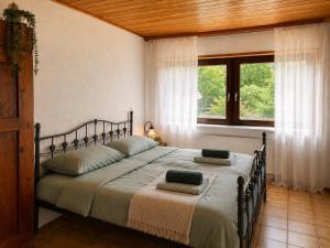 a bedroom with a bed with two pillows on it at Odw homes - Wohnung im Landhaus mit Garten in Trösel