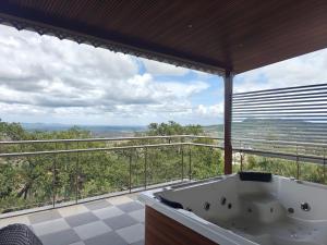 a bath tub in a bathroom with a view at The Metro Hotel in Panhāla