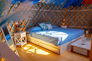 a bedroom with a bed in a tent at Podere Sorrentino in Offida