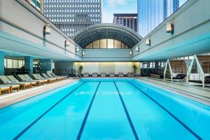 a swimming pool with chairs and a building at Sheraton Boston Hotel in Boston