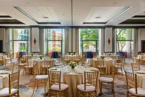 a banquet room with tables and chairs and windows at Sheraton Boston Hotel in Boston