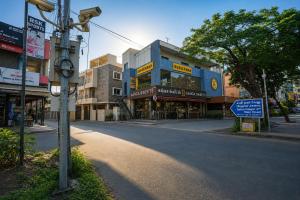 an empty street in a city with buildings at Blessings select DLF in Chennai