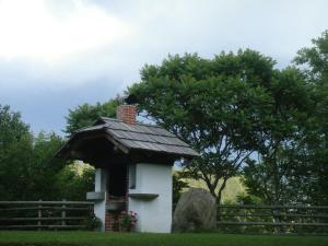 a bird perched on top of a bird house at Ferienwohnung Lahnerhof in Arriach