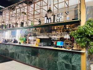 a bar in a restaurant with a counter and a counter at iNtsika Boutique in Johannesburg