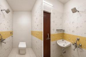 a bathroom with a toilet and a sink at FabHotel Mara Residency in Chennai +24 photos