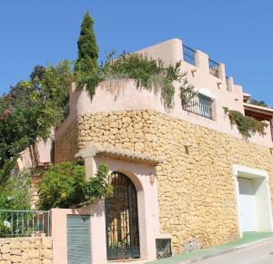 an old stone building with a tree on top of it at Altea Hills Villa Casablanca 23 in Altea