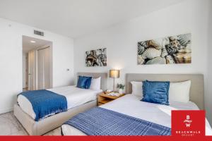 two beds sitting next to each other in a room at New High-Floor Studio Bay & Private Balcony in Hallandale Beach