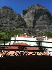 a view of a building with a mountain in the background at Hotel Rex in Kalabaka