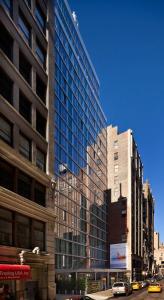 a city with tall buildings and cars on a street at INNSiDE by Meliá New York Nomad in New York