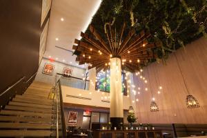 a building with a spiral staircase and aasteryasteryasteryasteryasteryasteryasteryastery at INNSiDE by Meliá New York Nomad in New York