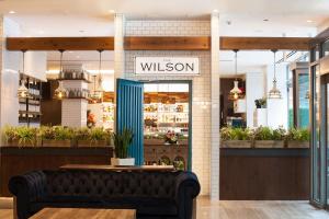 a shop with a couch in front of a window at INNSiDE by Meliá New York Nomad in New York +52 photos