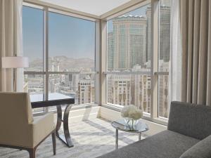 a living room with a view of a city at Jabal Omar Hyatt Regency Makkah in Mecca