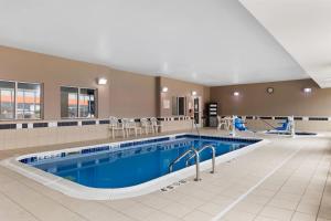 a large pool in a hotel room with a pool at Comfort Inn & Suites Marion I-57 in Marion