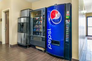 a pepsi machine next to a drink refrigerator at Comfort Inn Ottawa Kansas in Ottawa