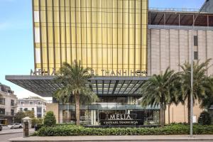 a building with a sign on the front of it at Meliá Vinpearl Thanh Hoa in Thanh Hóa