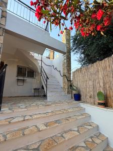 a set of stairs leading up to a house at Maison Pelops Petalidi in Petalidi