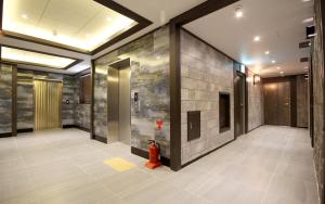 a hallway with a fire hydrant in a building at Ulsan Seongnam Hotel Mar in Ulsan