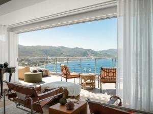 a living room with a view of the ocean at The Lighthouse in Simonʼs Town