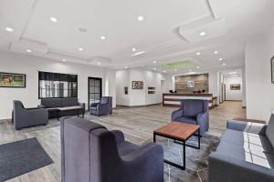a waiting room with couches and a table at Quality Inn & Suites Ocala I-75 in Ocala