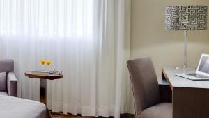 Llit o llits en una habitació de Sercotel JC1 Murcia 51 fotos més