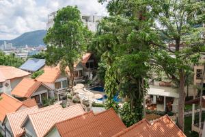 an overhead view of roofs of houses and trees at Club Bamboo Boutique Patong Beach Resort in Patong Beach