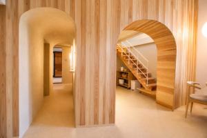 a hallway with a spiral staircase in a house at Villa KULM in Minamiawaji +15 photos