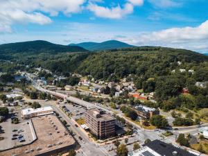 an aerial view of a town with mountains in the background at Hotel Downstreet, an Ascend Collection Hotel in North Adams