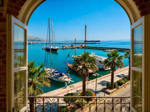a view from a window of a harbor with boats at Neossiko Chios in Chios