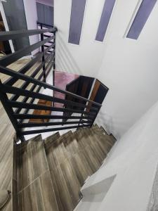 a staircase in a building with wooden stairs at departamento para Hospedaje en zacatlan in Zacatlán