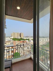 a balcony with a view of a city at Shivara Homes in Jaipur