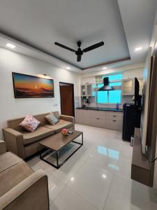 a living room with a couch and a table at Shivara Homes in Jaipur