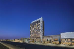 a rendering of a tall building at night at DoubleTree by Hilton Madinah Gate in Medina